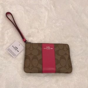 Tan and Magenta Coach Wristlet